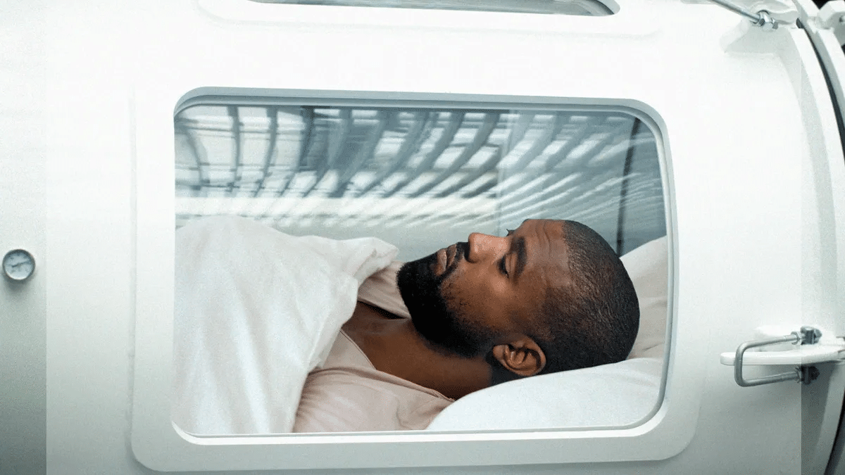 A patient sleeping inside a hyperbaric chamber  