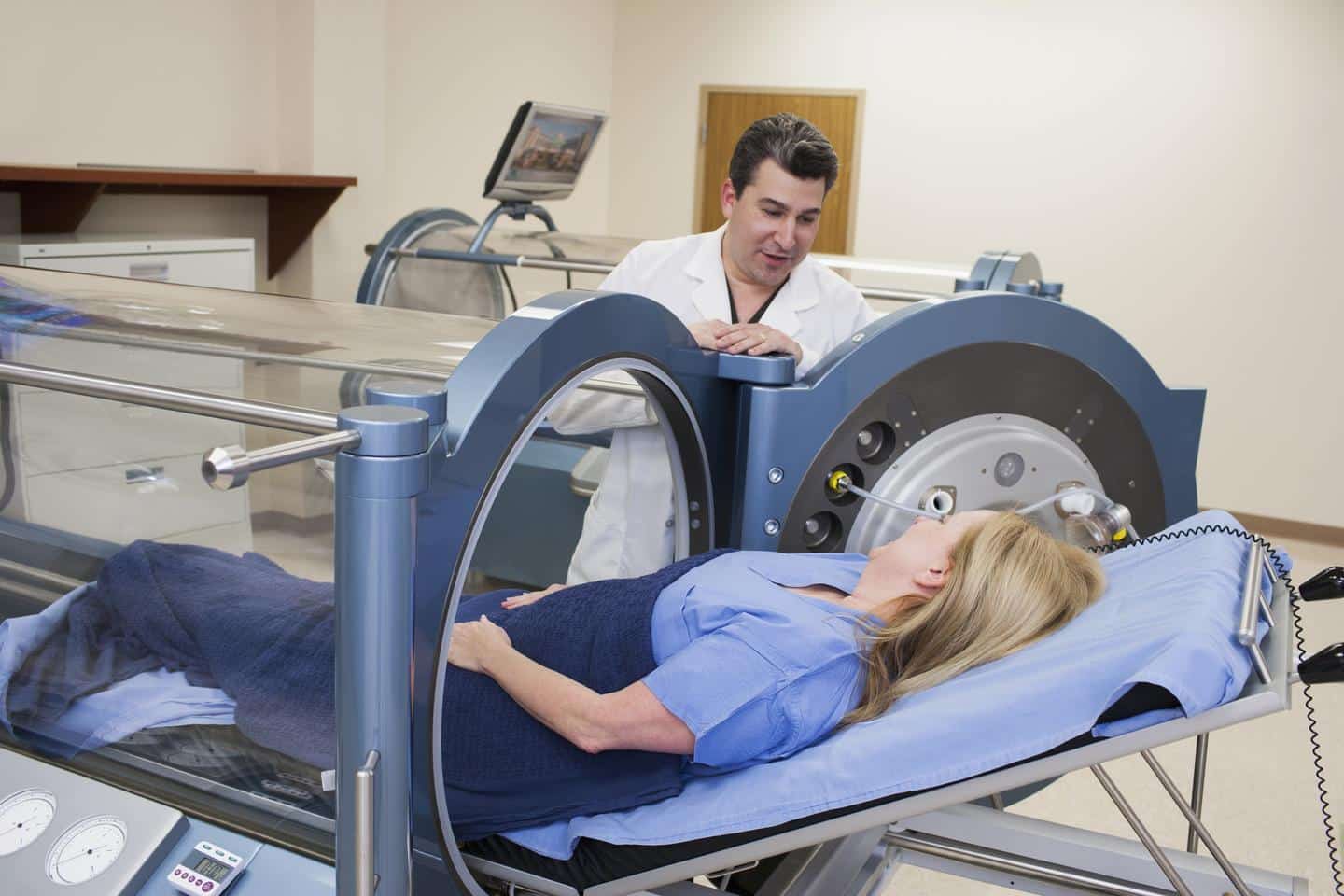 Patient undergoing treatment in a hyperbaric chamber