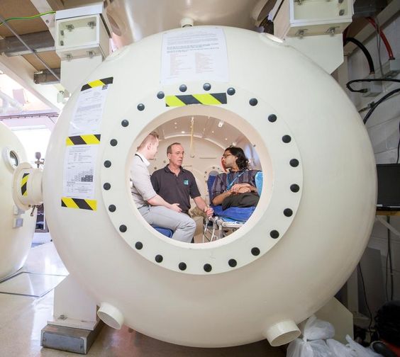 Patients inside the hyperbaric chamber undergoing treatment