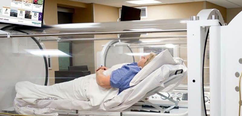 A patient in a hyperbaric chamber